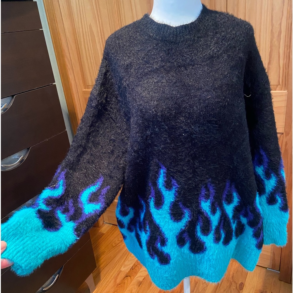 Brand new never worn Adika sweater. One size.